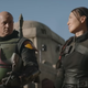 The helmet-less Boba Fett and Fennic Shand walks the streets of an unknown city of Tatooine.